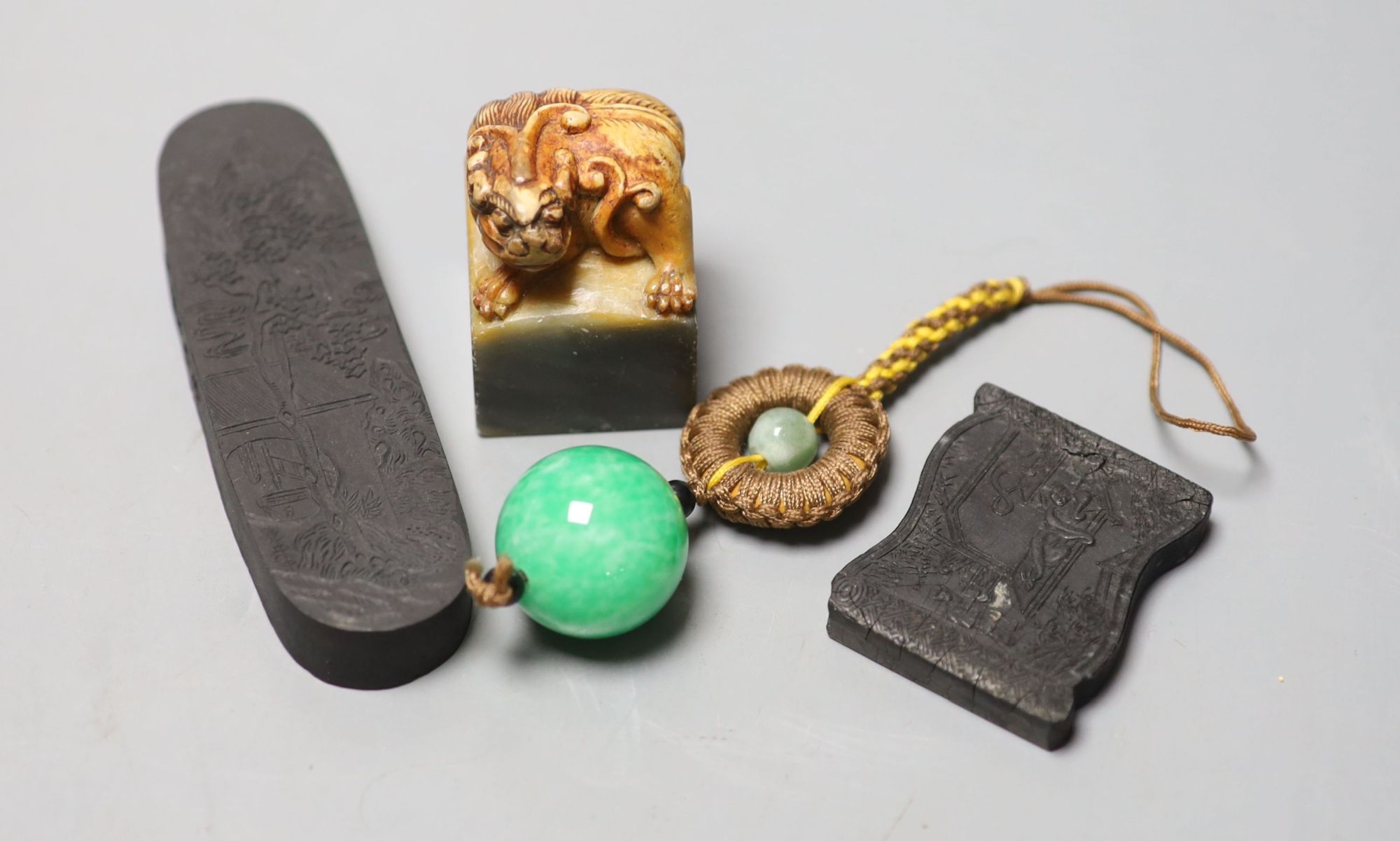 Assorted Chinese small items including two Chinese inkstones, a similar hardstone seal and pendant